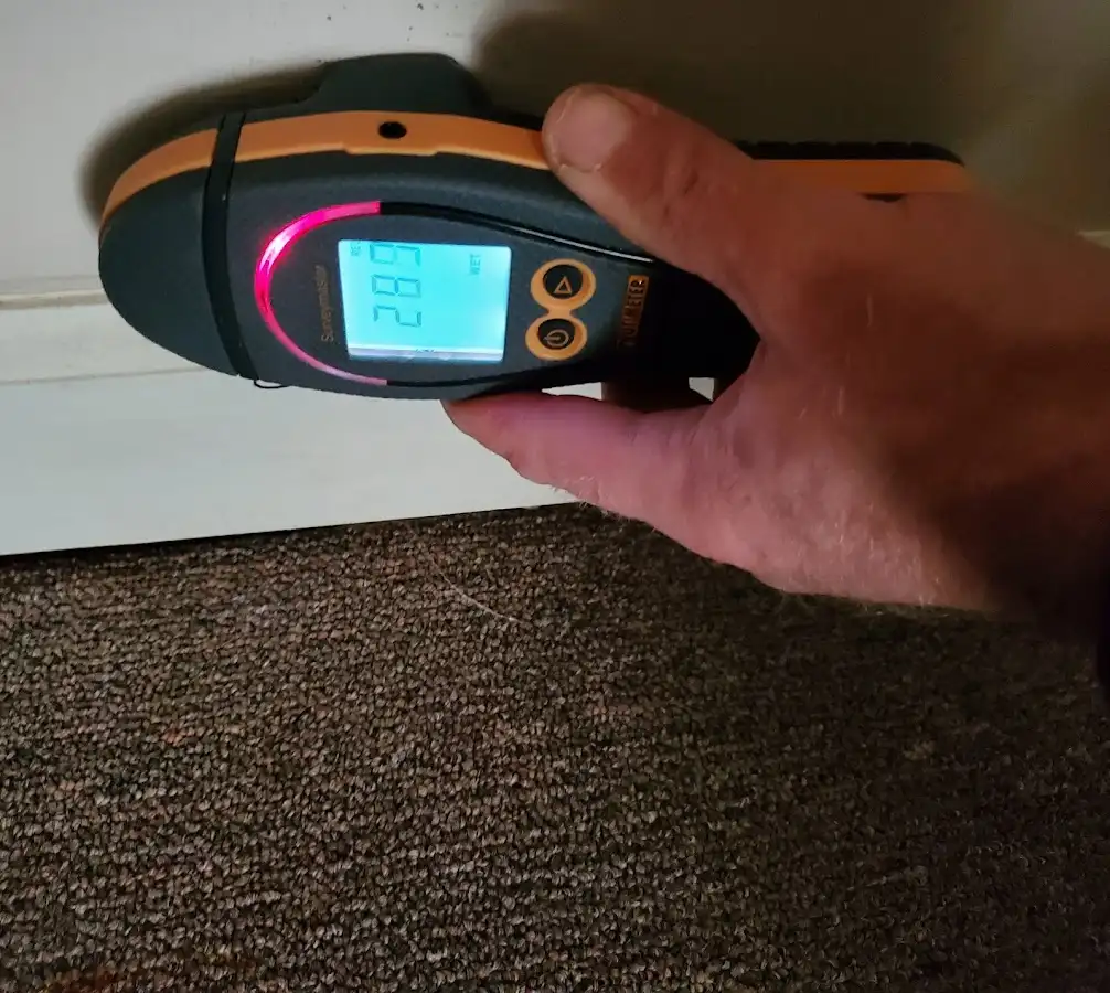 Moisture detection at baseboard during Sewage Cleanup & Sanitation in Midway City
